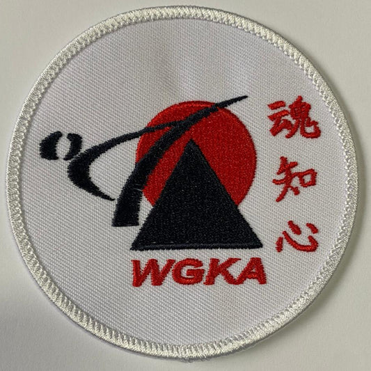 Circular patch with WGKA logo on a white background